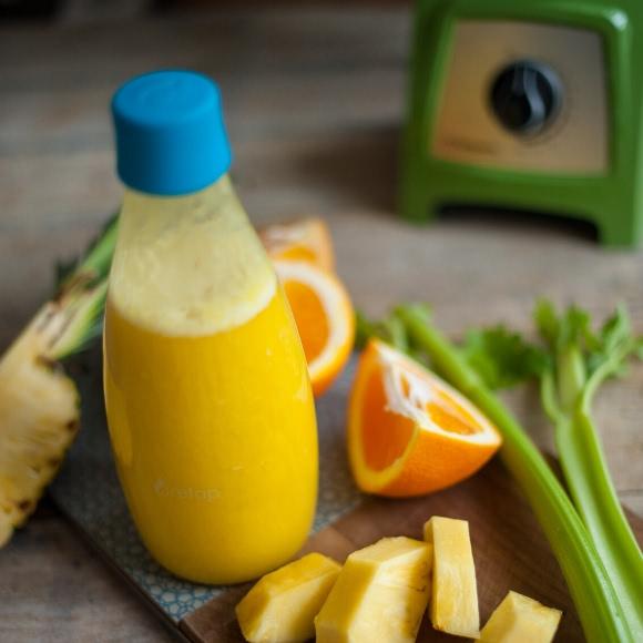 Green smoothies recipe for beginners with celery, orange and pineapple